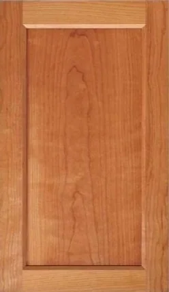 Artesia cabinet door in cherry with a wide flat frame and recessed panel
