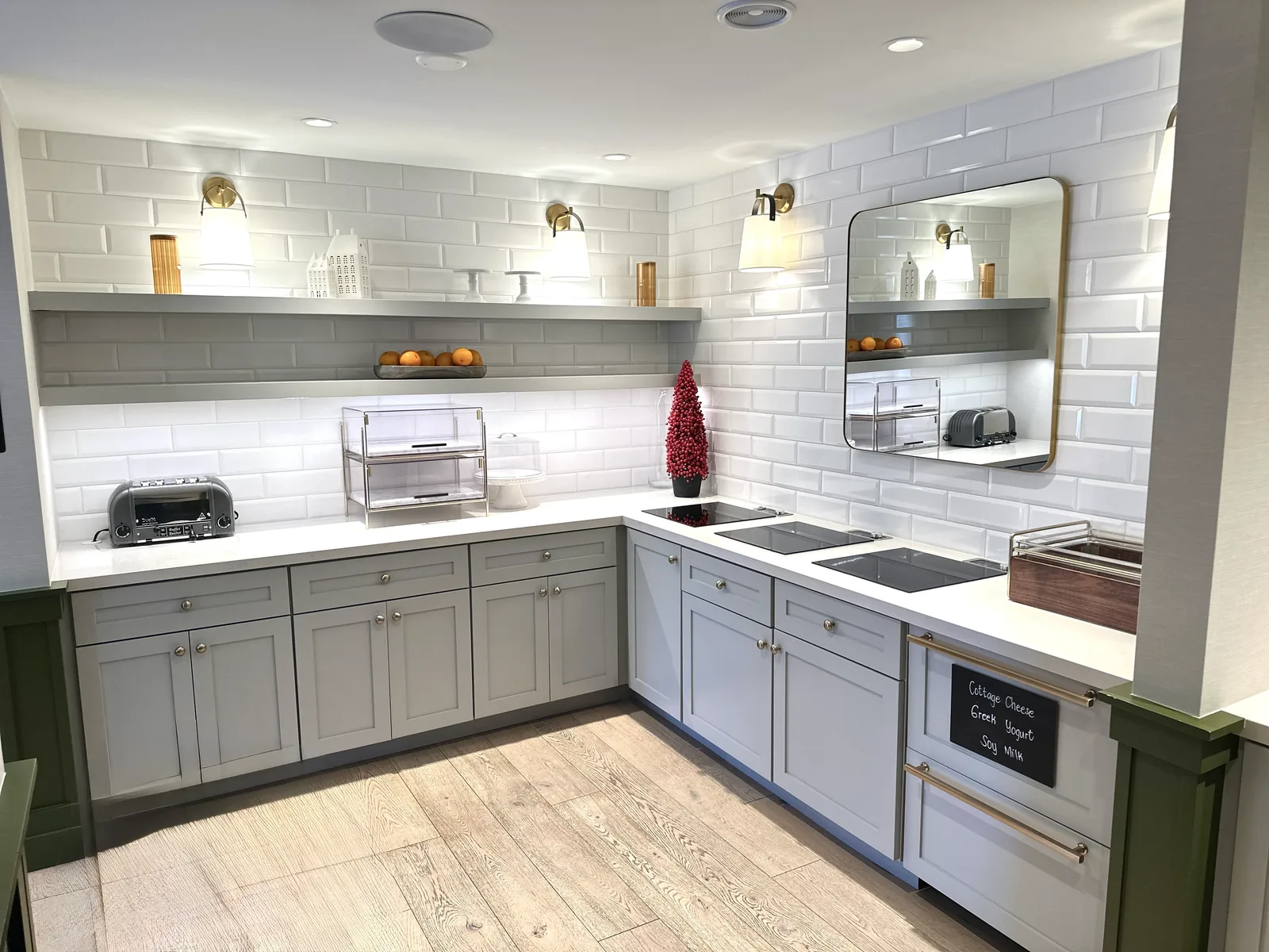 Grey kitchenette with quartz counter and an open display shelf in Atherton