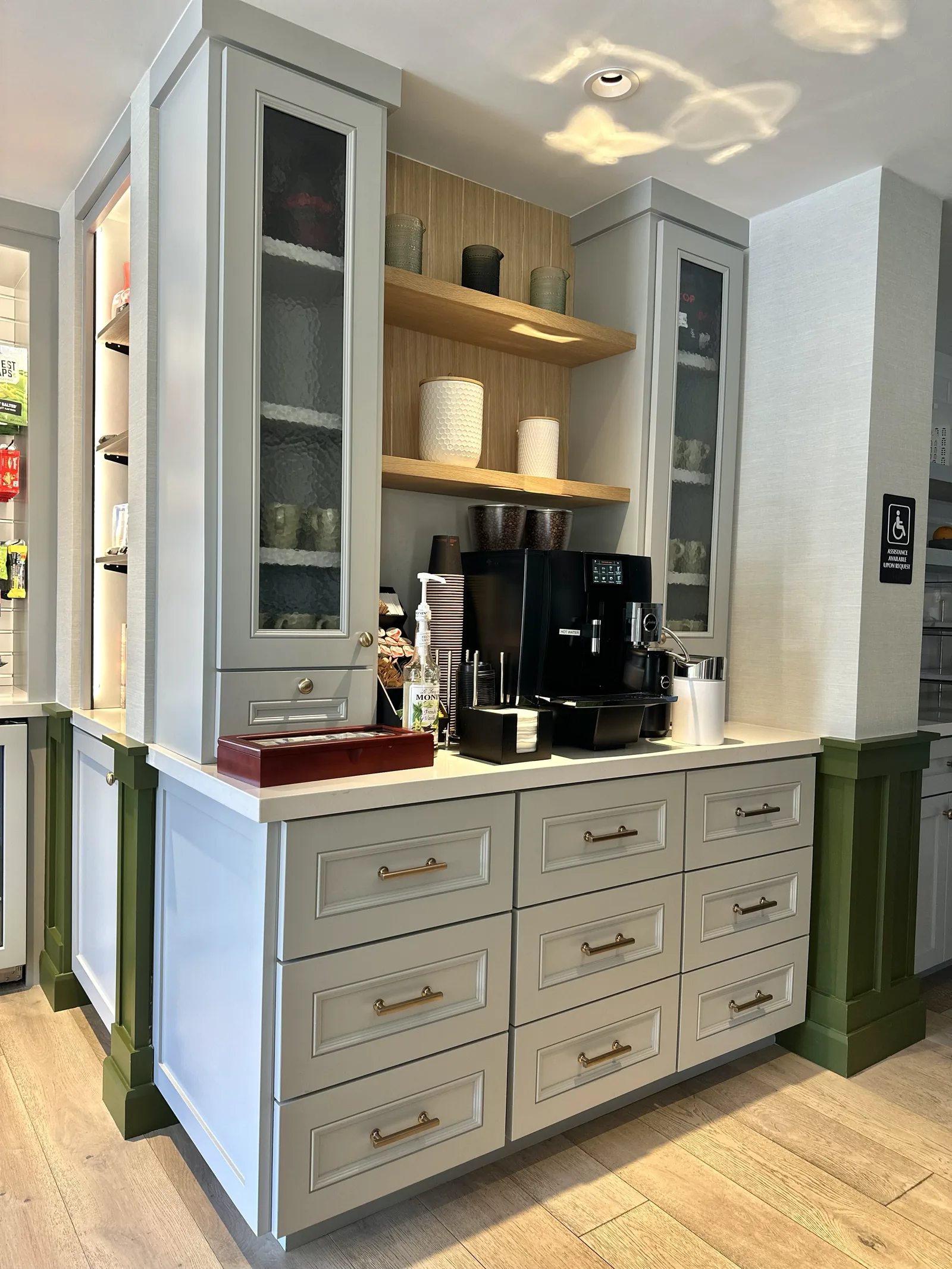 Office coffee station with grey drawers and white oak floating shelves in Atherton