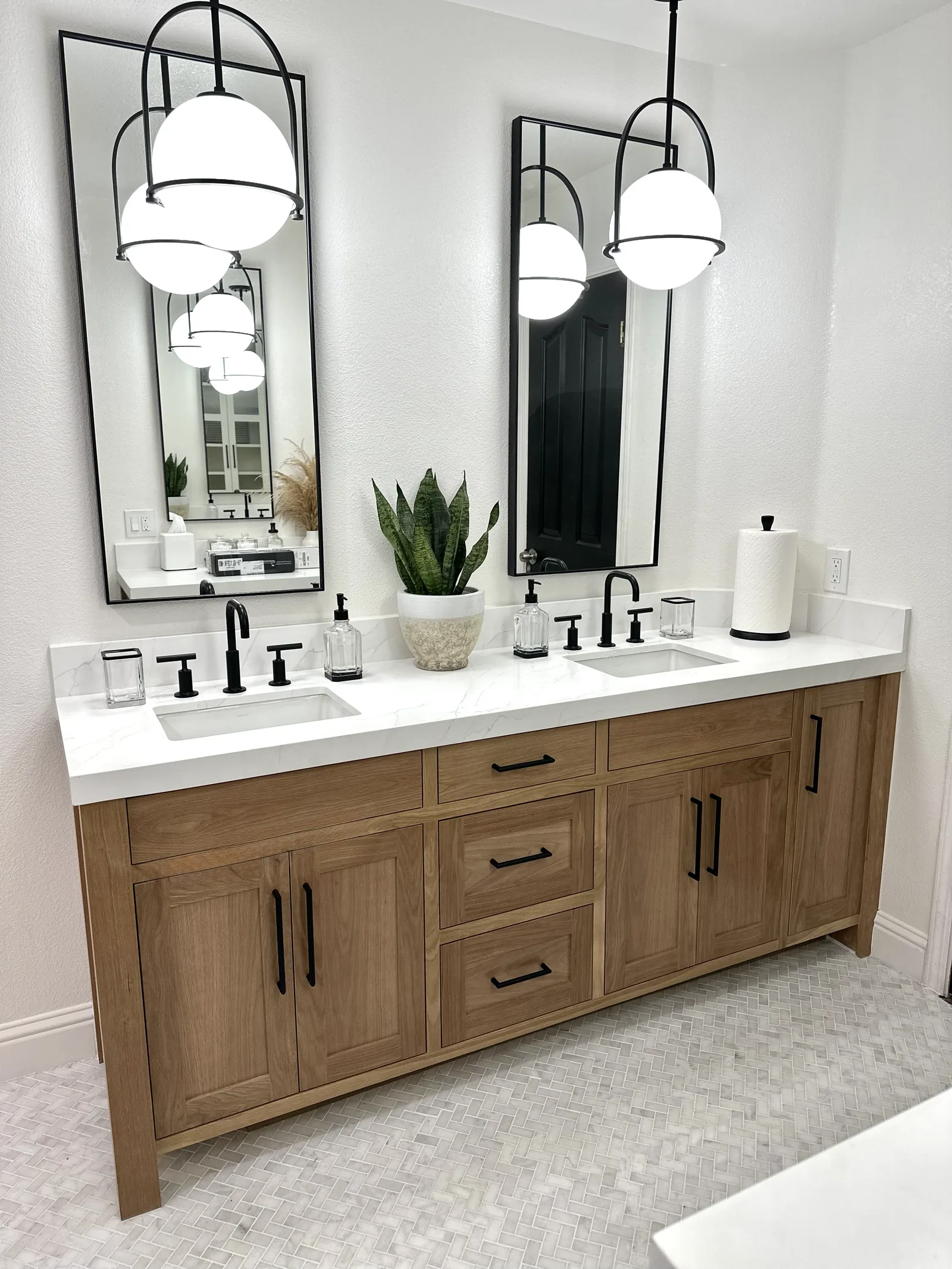 Light stained oak double vanity with black hardware and quartz top in Gilroy
