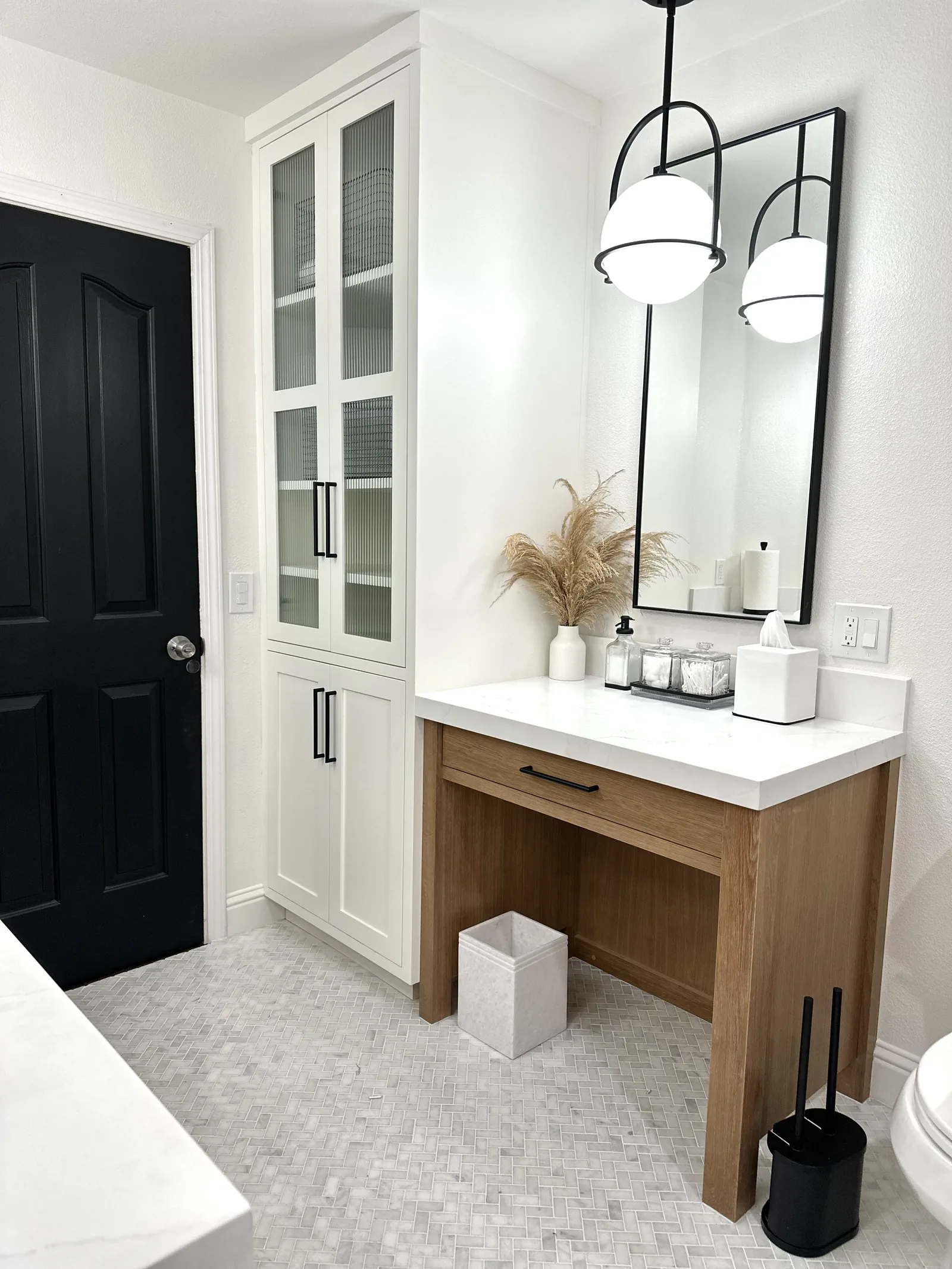 White shaker cabinet paired with a seated white oak makeup vanity in Gilroy