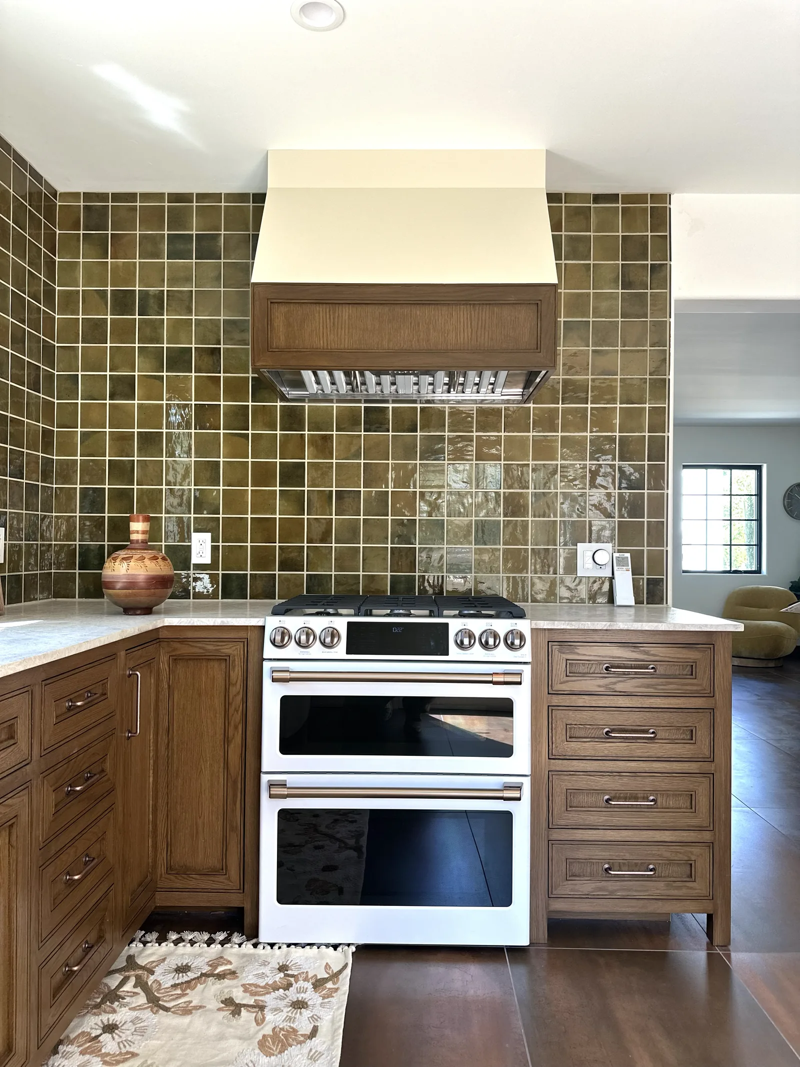 White oak kitchen with a custom wood hood and olive green tile in Gilroy