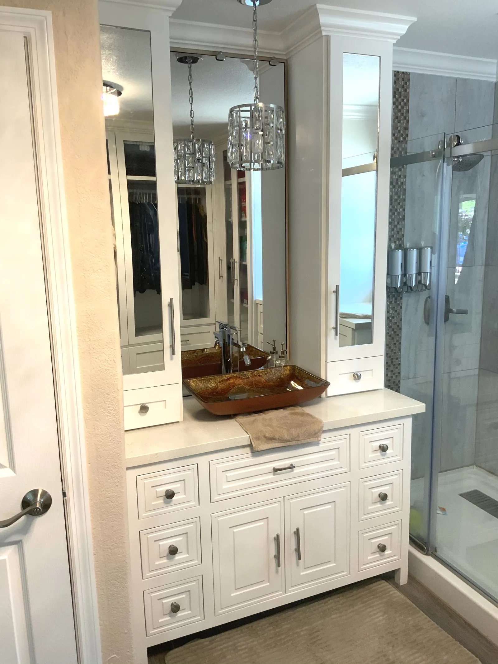 White raised panel bathroom vanity with a framed mirror beside the shower in Gilroy
