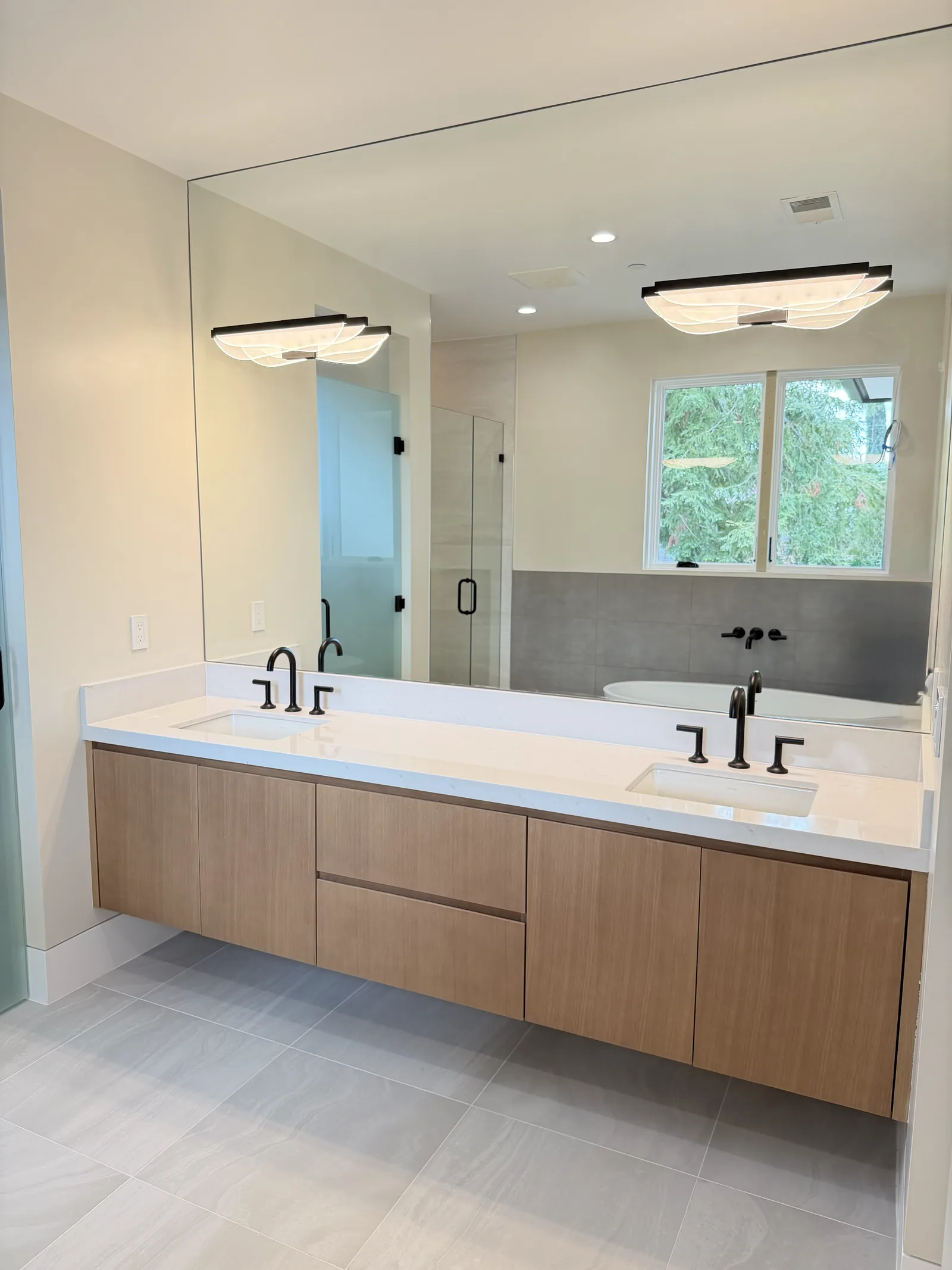 White oak floating double vanity with a full width mirror in Los Altos
