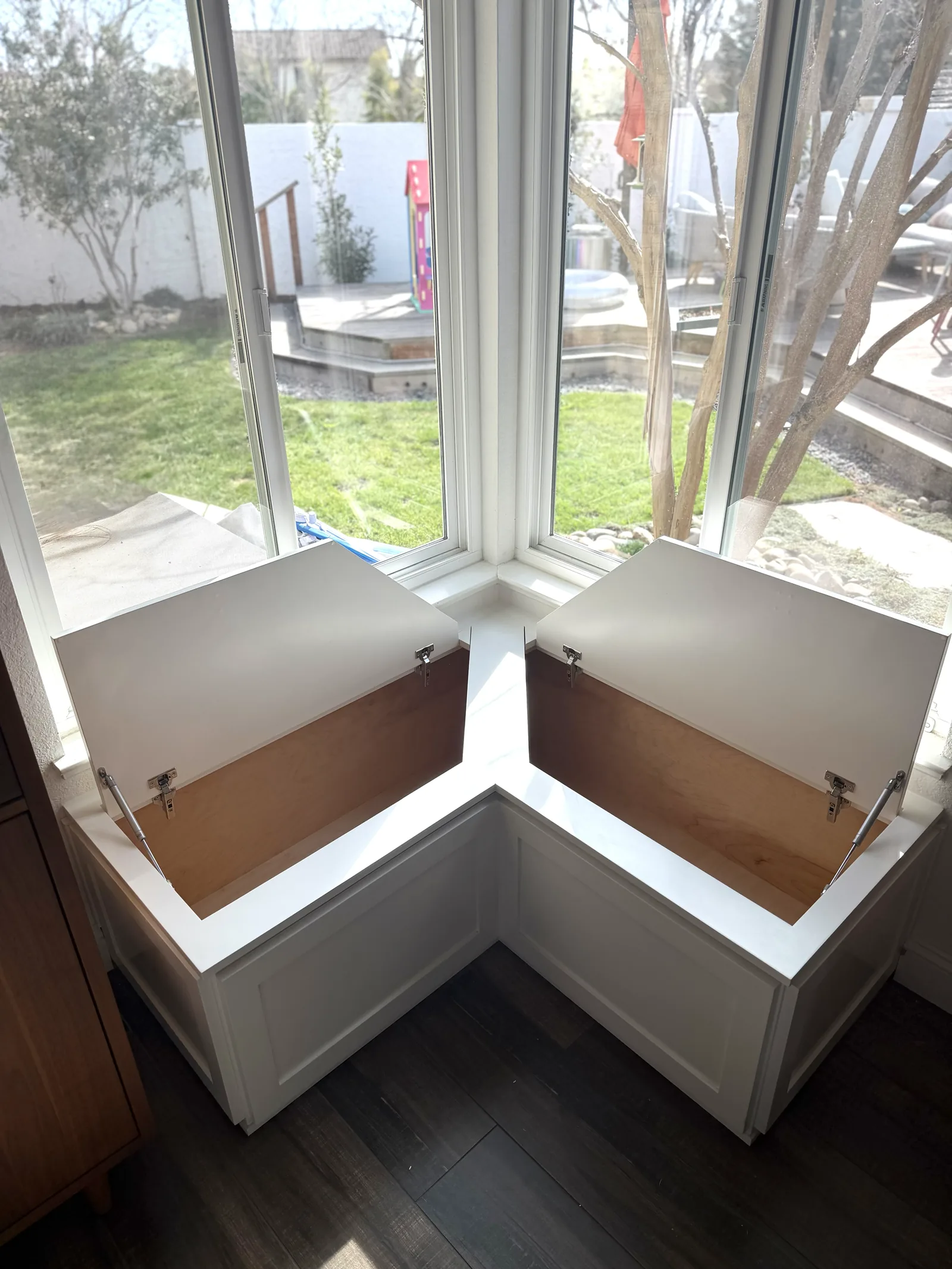 Window bench with the lift-up storage lids open in a Morgan Hill home