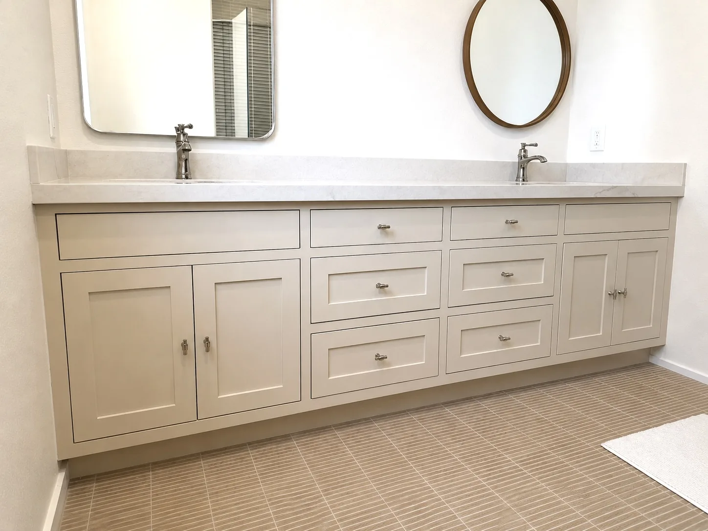 Long greige shaker double vanity with quartz counter in Portola Valley