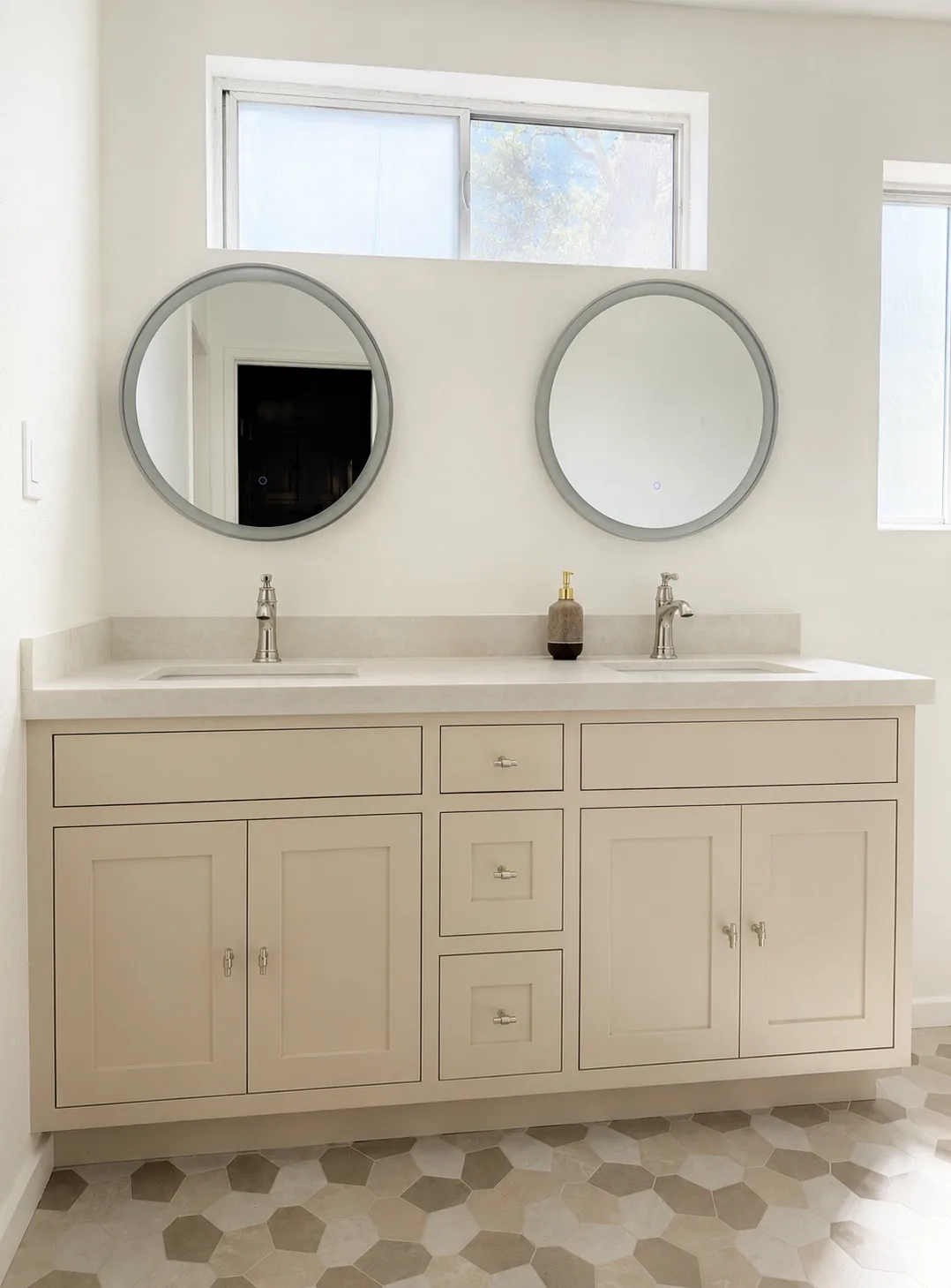 Greige shaker double vanity with round mirrors and quartz top in Portola Valley