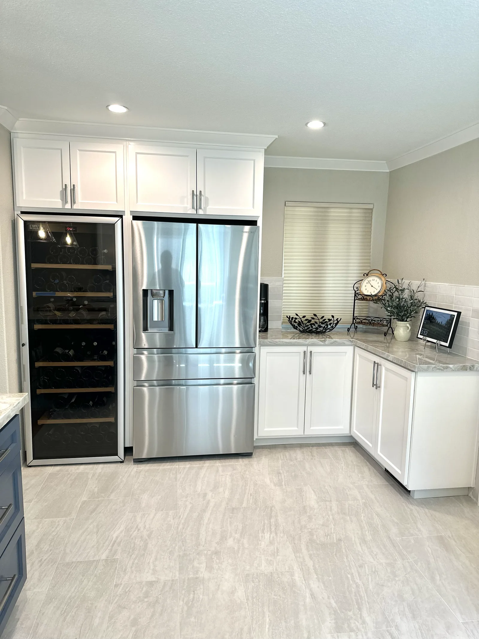 White shaker kitchen with a full height wine fridge column in San Jose