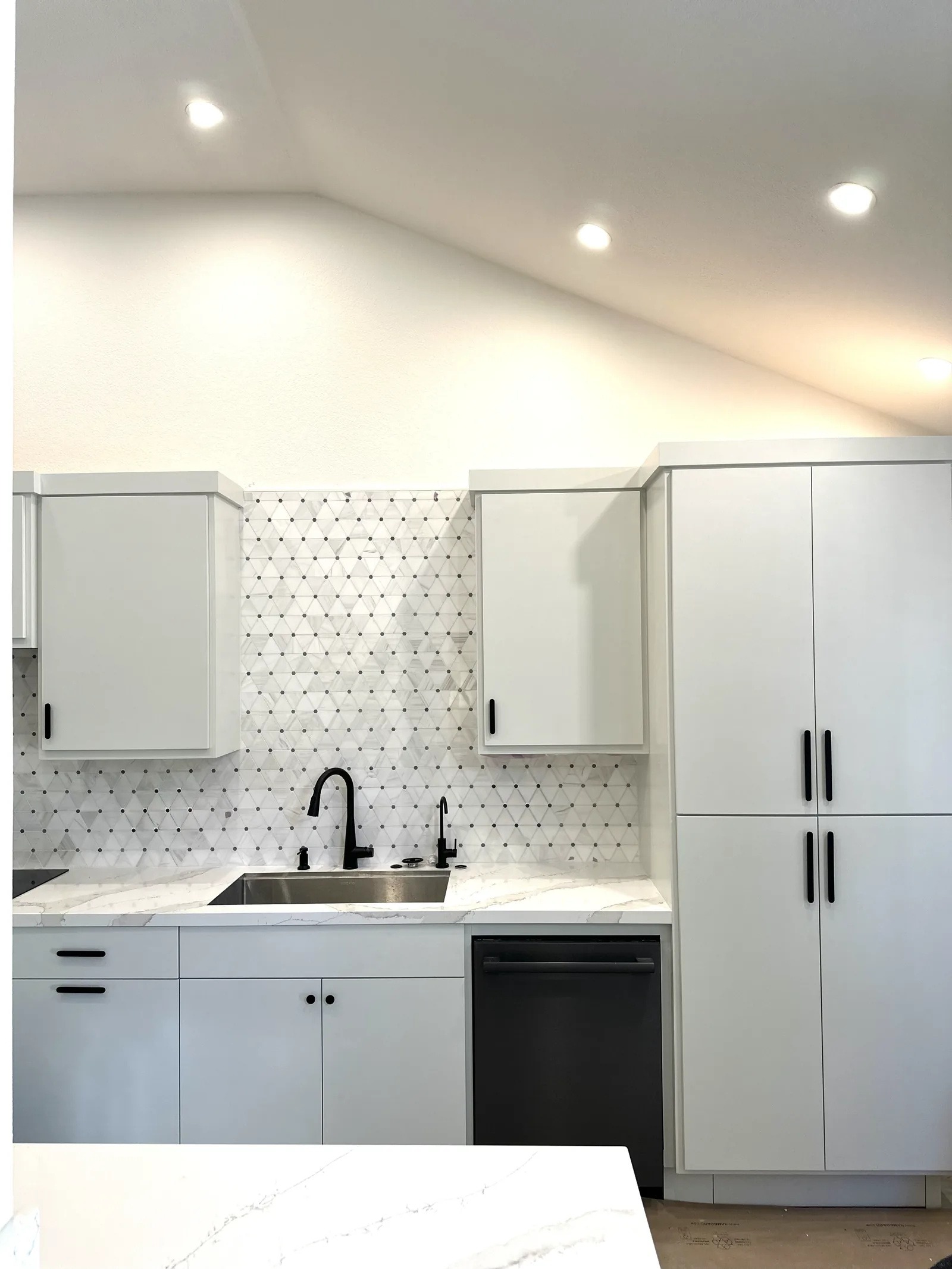 White wet bar with upper glass storage and a quartz counter in San Jose