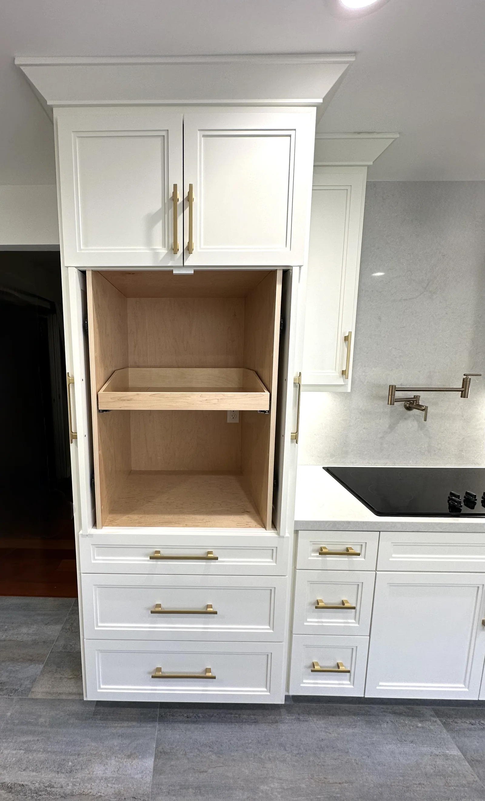 Appliance garage with a lift-up door open above the counter in Santa Clara