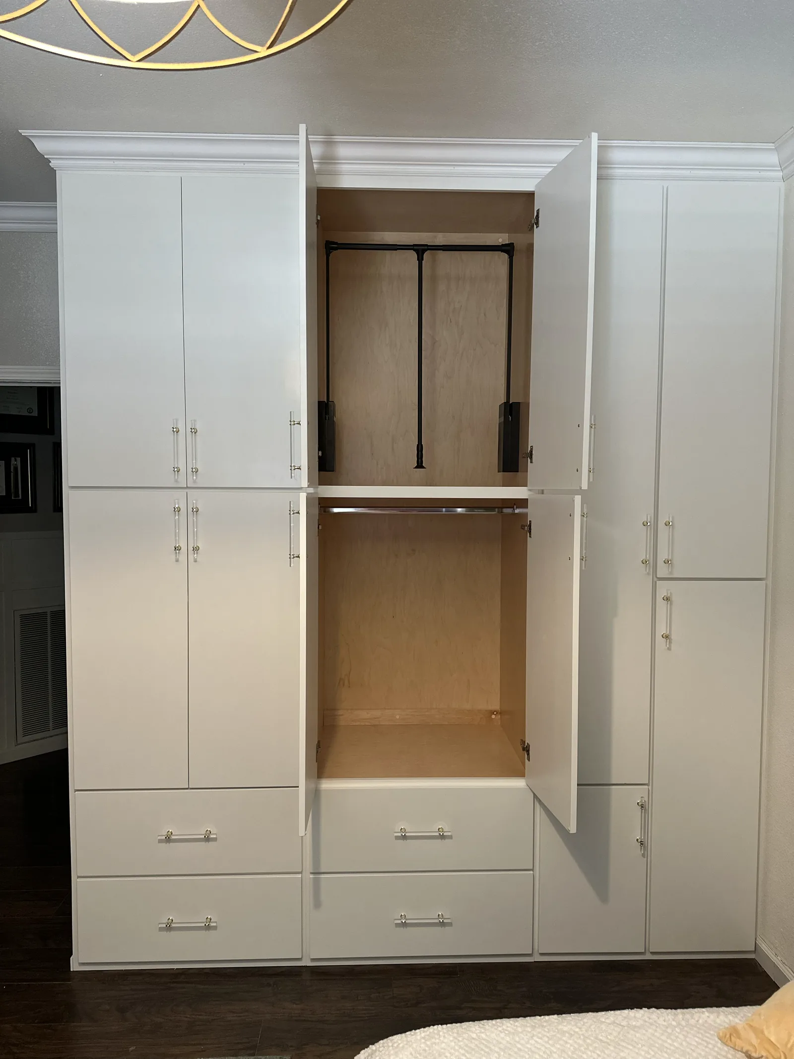 White built-in wardrobe with hanging rods and drawer bank in Soledad